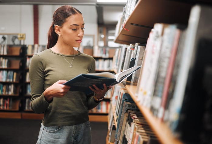 woman-studying-library